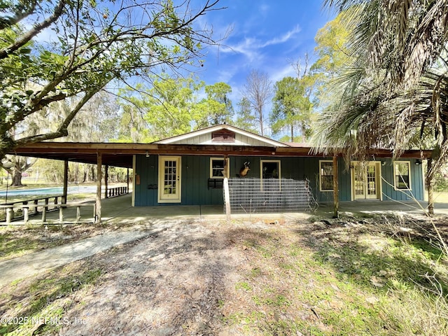 view of front of property featuring an attached carport and board and batten siding