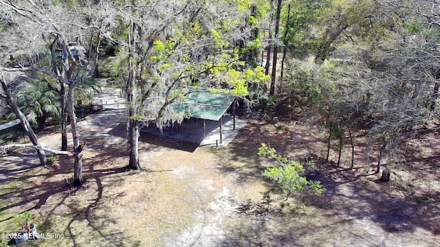 drone / aerial view with a view of trees