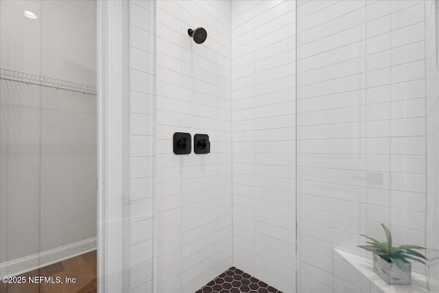 bathroom with a tile shower