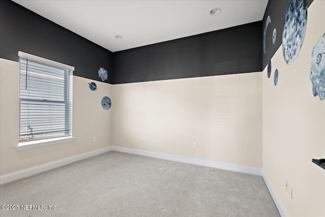 empty room with carpet flooring and baseboards