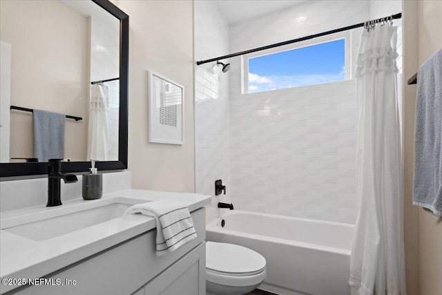 bathroom featuring vanity, toilet, and shower / bath combo with shower curtain