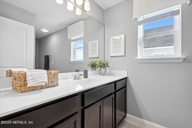 bathroom featuring vanity and baseboards