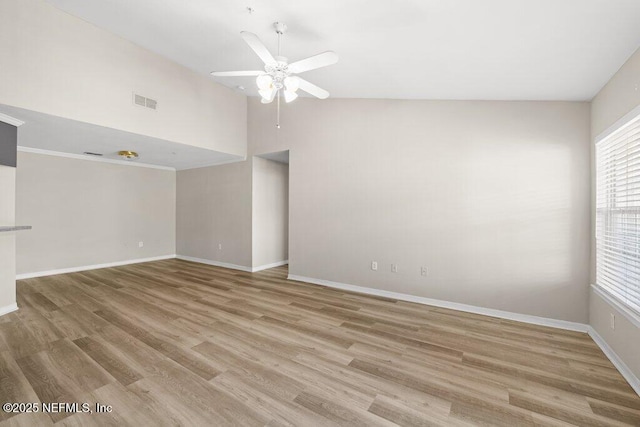 7800 Point Meadows Dr Unit 736, Jacksonville, FL 32256 - spare room with visible vents, baseboards, wood finished floors, high vaulted ceiling, and a ceiling fan