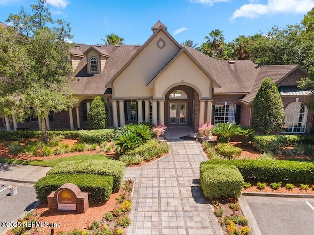 7800 Point Meadows Dr Unit 736, Jacksonville, FL 32256 - view of front of home with french doors and a shingled roof