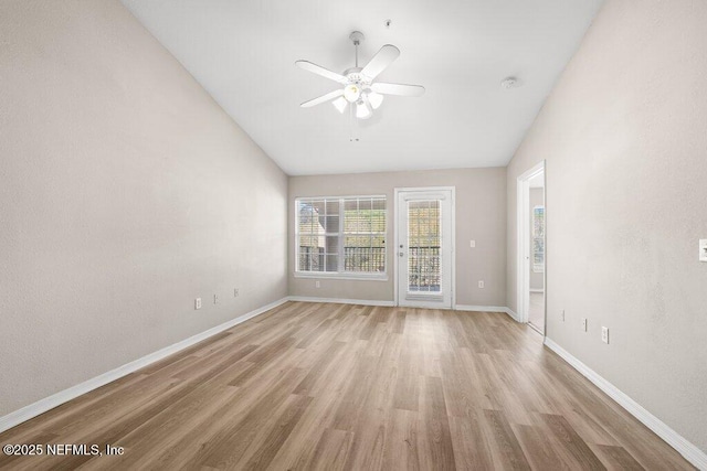 7800 Point Meadows Dr Unit 736, Jacksonville, FL 32256 - spare room featuring lofted ceiling, light wood-style flooring, baseboards, and ceiling fan
