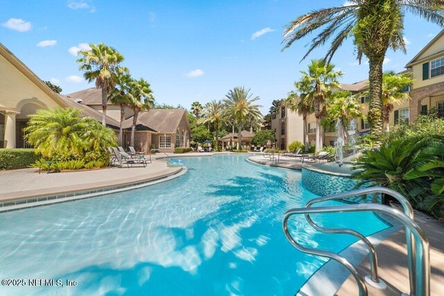 7800 Point Meadows Dr Unit 736, Jacksonville, FL 32256 - community pool featuring a patio area