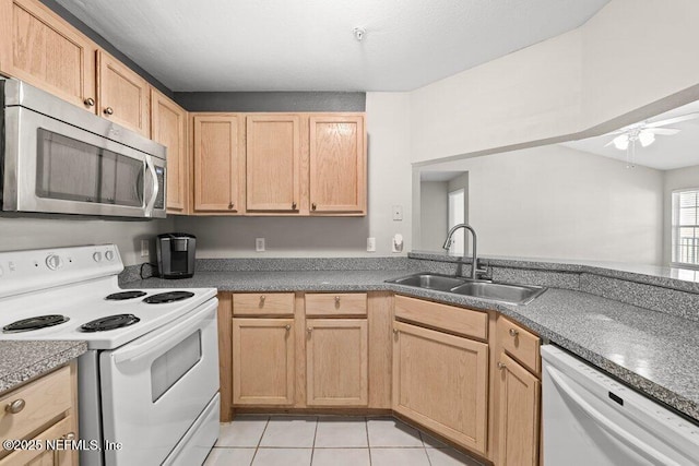 7800 Point Meadows Dr Unit 736, Jacksonville, FL 32256 - kitchen featuring a sink, white appliances, light brown cabinetry, and light tile patterned floors