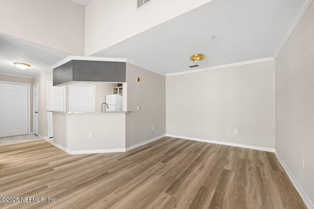 7800 Point Meadows Dr Unit 736, Jacksonville, FL 32256 - unfurnished living room featuring baseboards, wood finished floors, visible vents, and ornamental molding