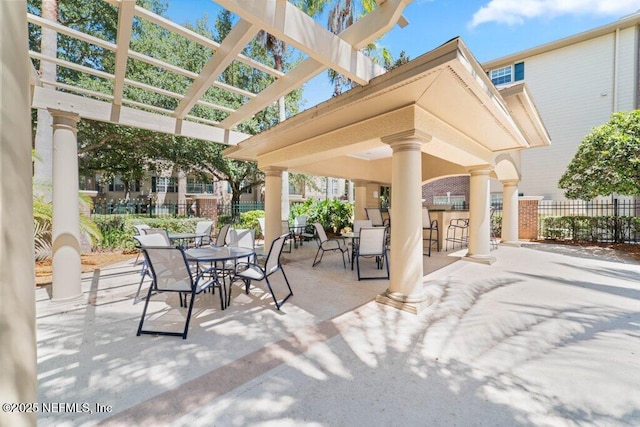 7800 Point Meadows Dr Unit 736, Jacksonville, FL 32256 - view of patio / terrace featuring fence, outdoor dry bar, and a pergola