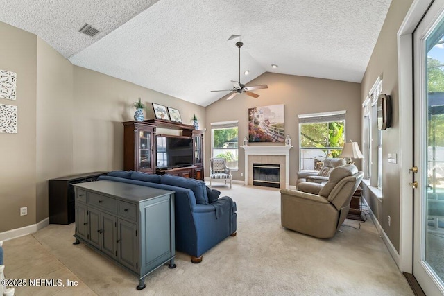 1341 Honeysuckle Dr, Saint Johns, FL 32259 - living area with lofted ceiling, ceiling fan, a fireplace, a textured ceiling, and plenty of natural light