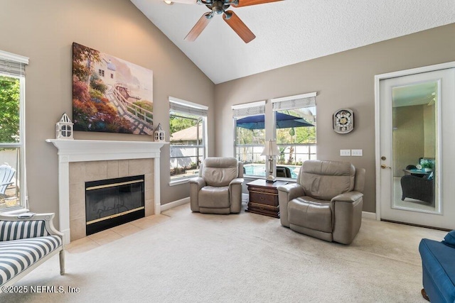 1341 Honeysuckle Dr, Saint Johns, FL 32259 - carpeted living area featuring ceiling fan, high vaulted ceiling, a fireplace, and plenty of natural light