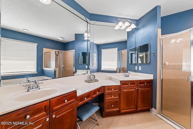 1341 Honeysuckle Dr, Saint Johns, FL 32259 - full bathroom with a stall shower, double vanity, tile patterned flooring, and a textured ceiling