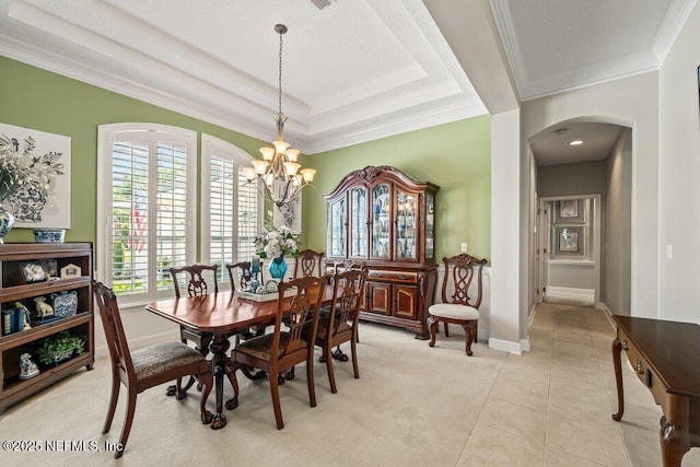 1341 Honeysuckle Dr, Saint Johns, FL 32259 - dining space featuring arched walkways, a chandelier, crown molding, light tile patterned floors, and baseboards
