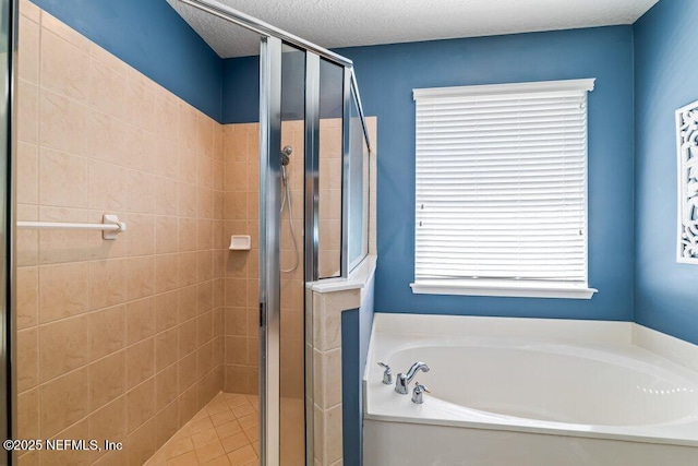 1341 Honeysuckle Dr, Saint Johns, FL 32259 - bathroom featuring a bath, a shower stall, and a textured ceiling