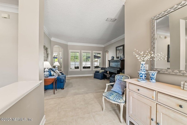 1341 Honeysuckle Dr, Saint Johns, FL 32259 - living area featuring light carpet, arched walkways, crown molding, light tile patterned floors, and baseboards