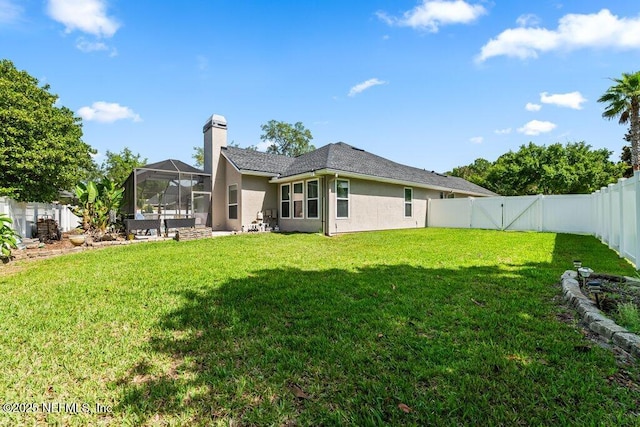 1341 Honeysuckle Dr, Saint Johns, FL 32259 - back of house with stucco siding, a chimney, and a gate
