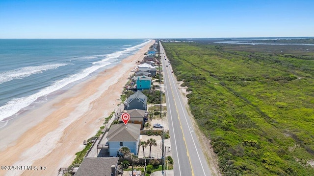 drone / aerial view with a view of the beach and a water view