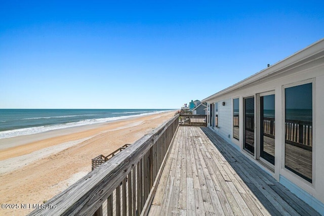 exterior space with a beach view and a water view