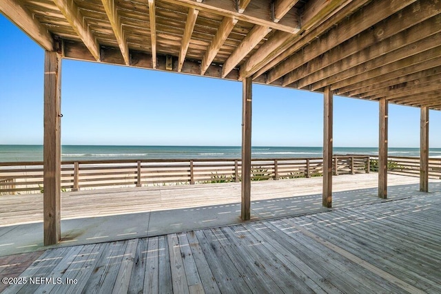 wooden deck featuring a water view