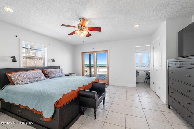 bedroom with multiple windows, access to exterior, a textured ceiling, and recessed lighting