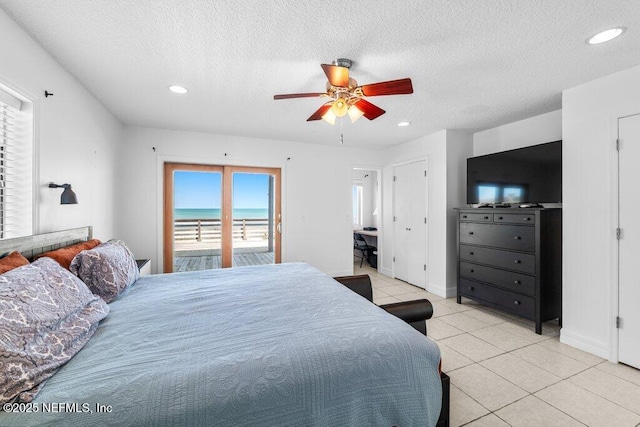 bedroom featuring a ceiling fan, a textured ceiling, light tile patterned floors, access to outside, and recessed lighting
