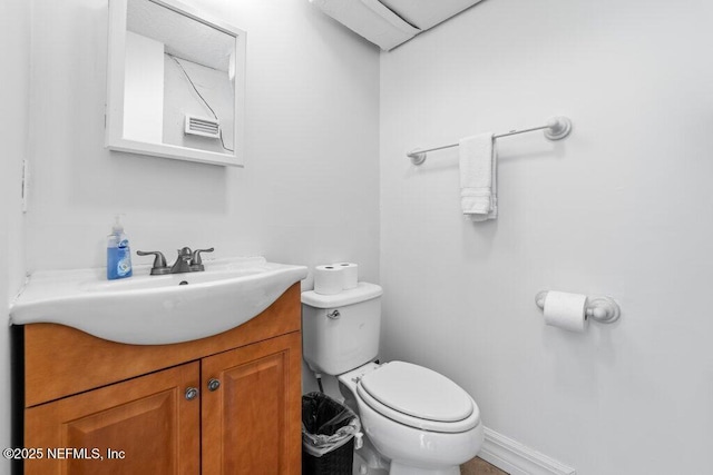 bathroom featuring toilet and vanity