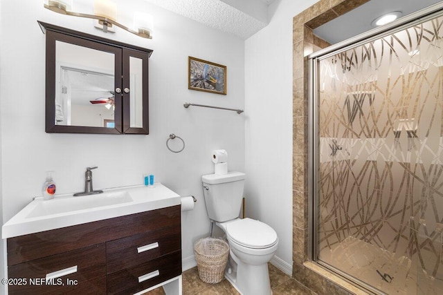 full bathroom featuring vanity, tile patterned flooring, a shower stall, and toilet