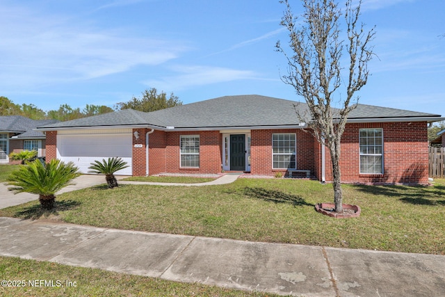 ranch-style house with concrete driveway, a front yard, a shingled roof, a garage, and brick siding