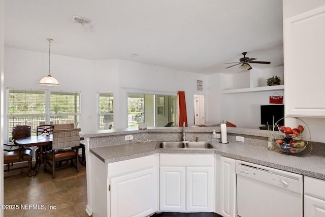 kitchen with visible vents, a sink, white cabinets, dishwasher, and ceiling fan