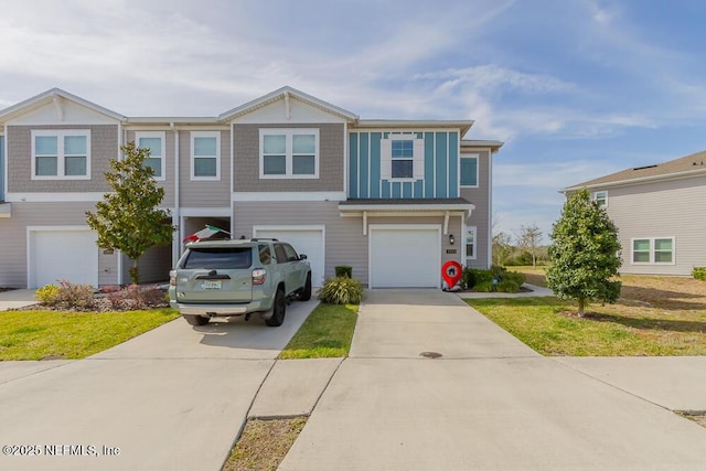 view of front facade with driveway and an attached garage