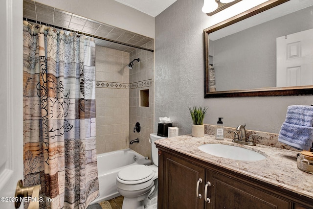 bathroom with toilet, shower / bath combination with curtain, vanity, and a textured wall