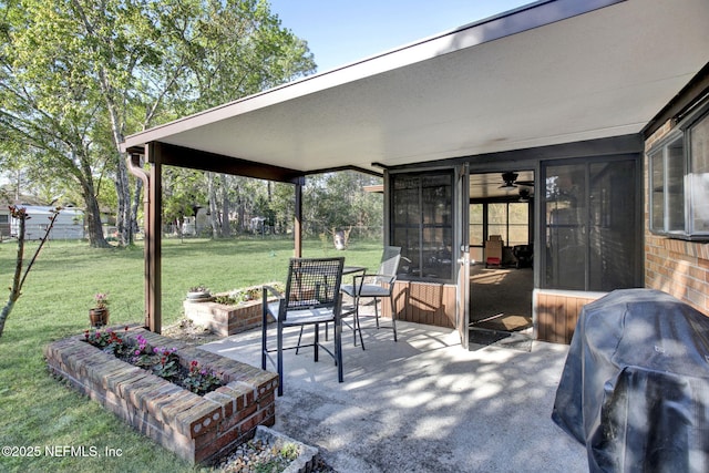 view of patio / terrace featuring grilling area and a sunroom