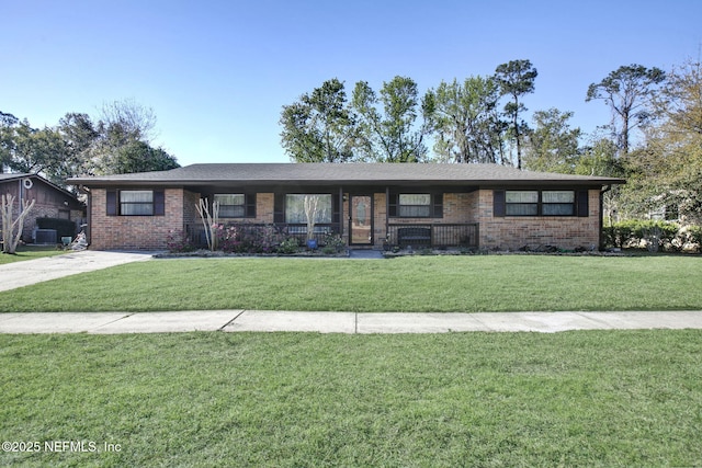 single story home featuring brick siding and a front lawn