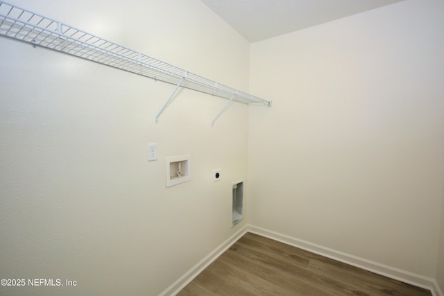 washroom with baseboards, washer hookup, laundry area, wood finished floors, and electric dryer hookup