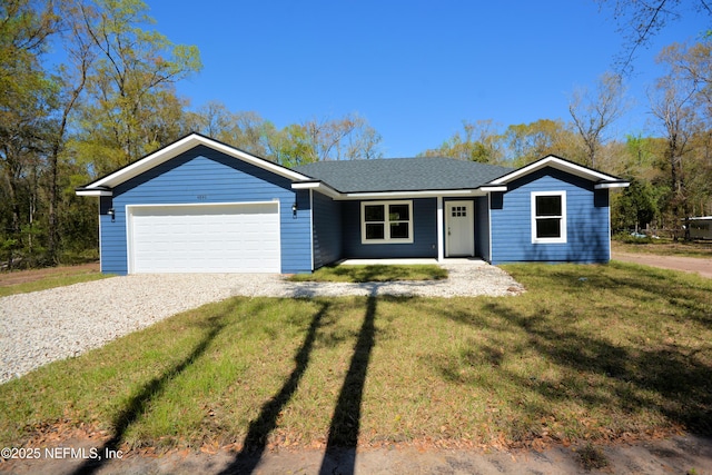 single story home with a garage, gravel driveway, and a front lawn