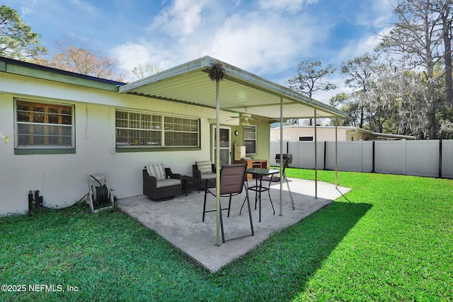 exterior space with an outdoor hangout area, a ceiling fan, and fence