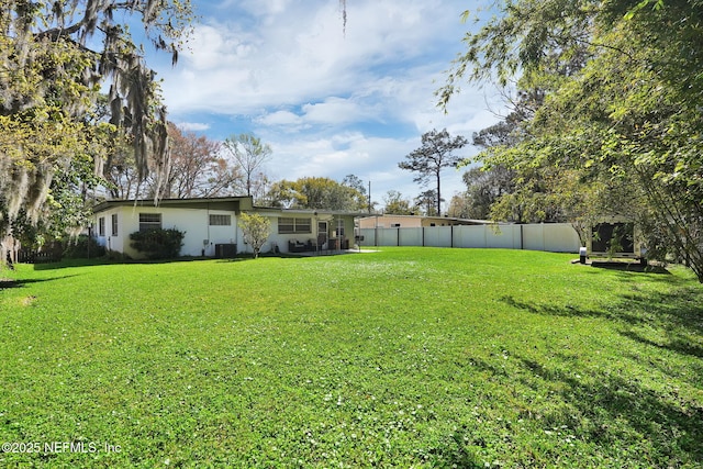 view of yard with fence