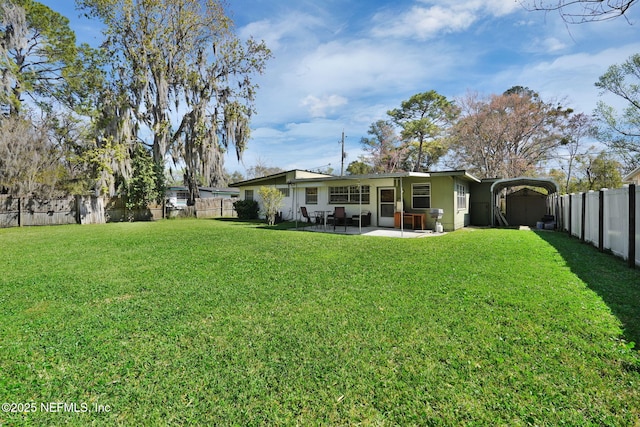 view of yard with a patio and a fenced backyard