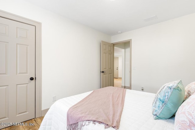 bedroom featuring wood finished floors