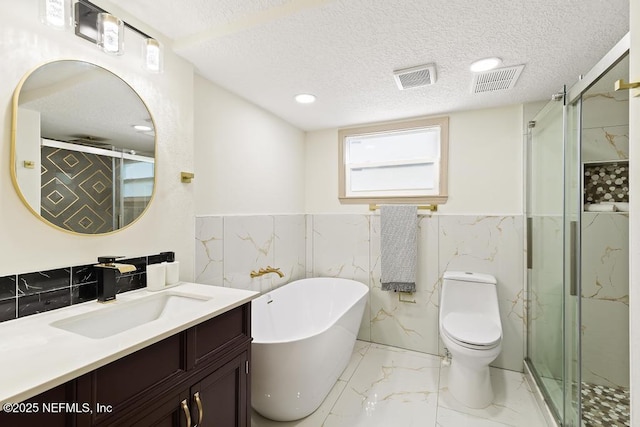 bathroom featuring visible vents, marble finish floor, a stall shower, and a textured ceiling