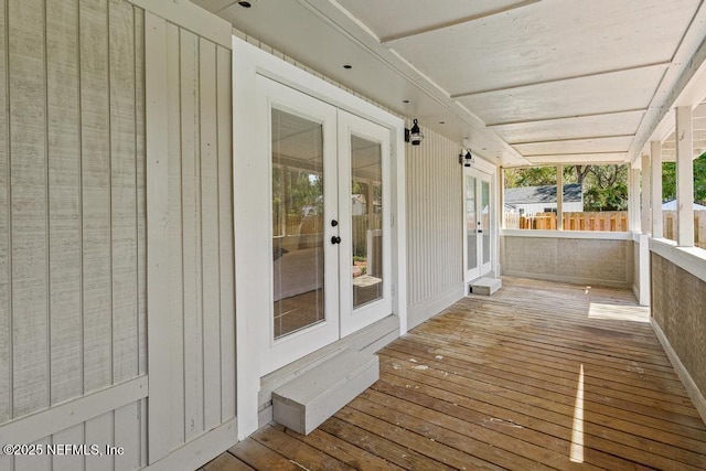 wooden deck featuring french doors