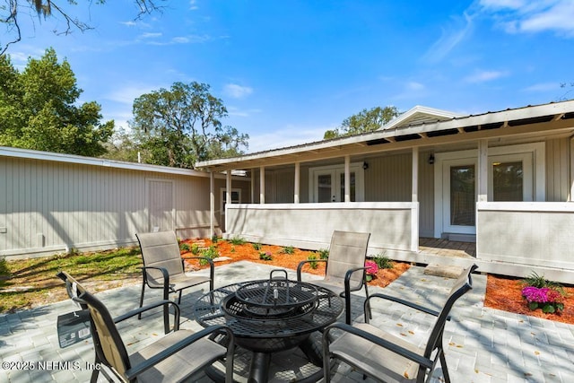 view of patio / terrace with a fire pit