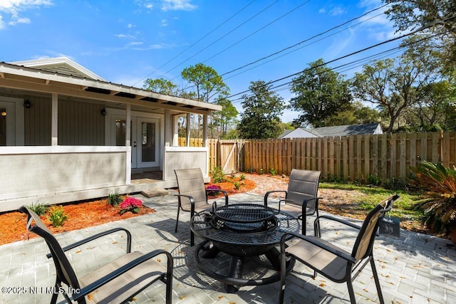 view of patio / terrace with french doors, fence private yard, and outdoor dining space