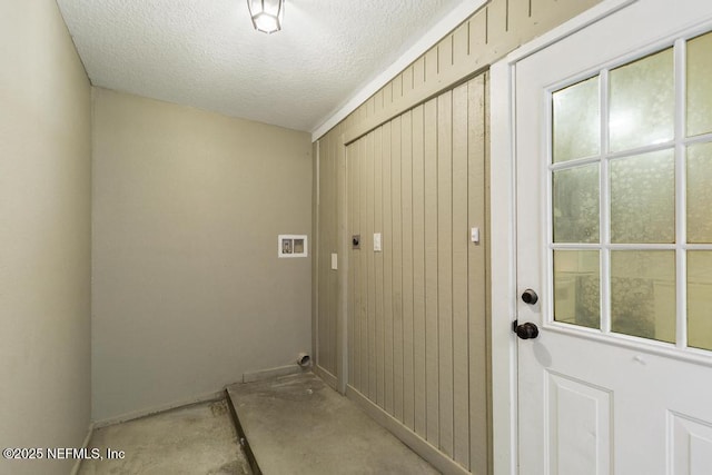 laundry room with washer hookup, laundry area, and a textured ceiling