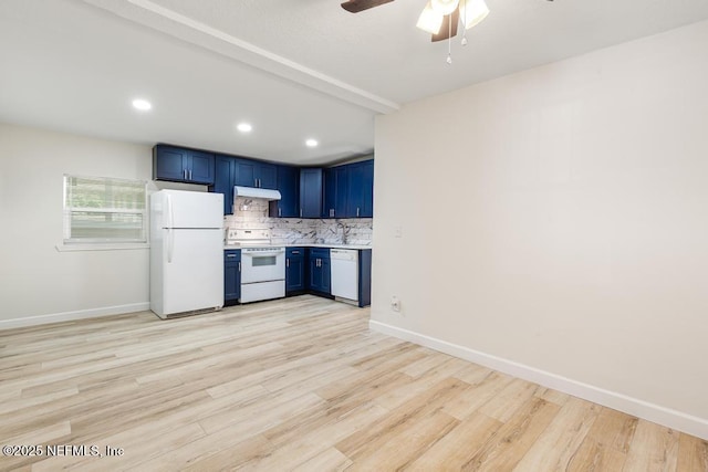 kitchen with white appliances, ceiling fan, under cabinet range hood, blue cabinets, and backsplash