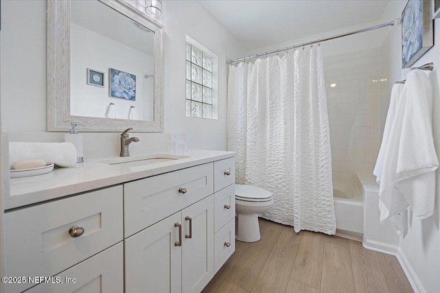 full bathroom with vanity, shower / bathtub combination with curtain, toilet, and wood finished floors