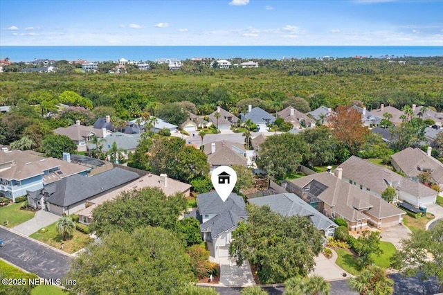 birds eye view of property with a residential view and a water view