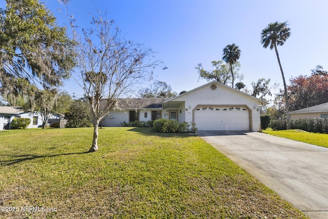 ranch-style house featuring an attached garage, concrete driveway, and a front lawn