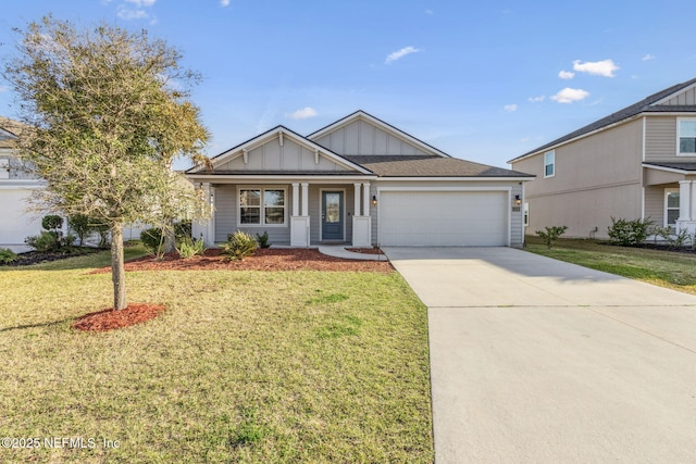 view of front of property featuring a front yard, an attached garage, board and batten siding, and driveway