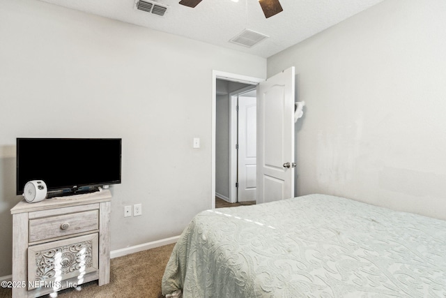 bedroom featuring visible vents, a ceiling fan, baseboards, and carpet floors